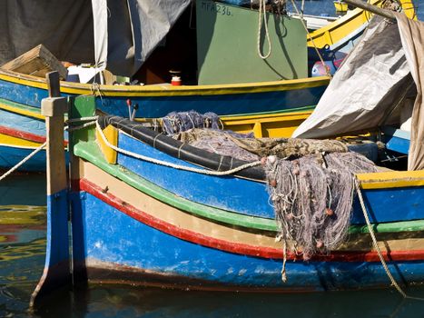 Traditional fishing boats of Malta in the fishing village of Marsaxlokk