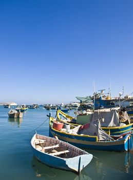 Traditional fishing boats of Malta in the fishing village of Marsaxlokk