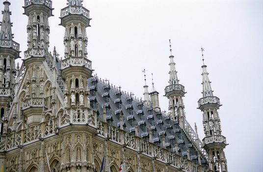 Detail of the ornate roof of the city hall building in Leuven, Belgium.