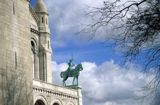 Statue of a horse and rider on Sacre Coeur in Paris, France.