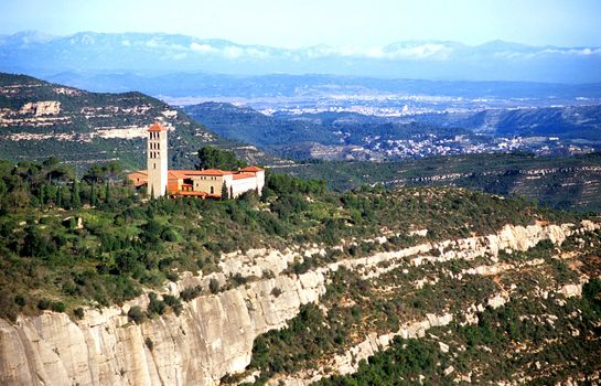 A monastery in the mountains of Catalonia, Spain has an inspirational view of the coutryside.