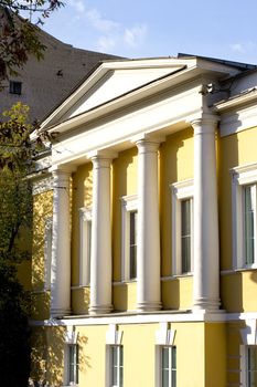 Facade of mansion with columns at summer time. Moscow, Russia.