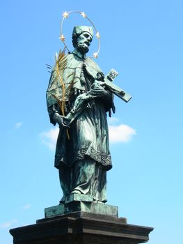 Statue of St John of Nepomuk on Charles Bridge in Prague. St John of Nepomuk is the national saint of the Czech Republic.