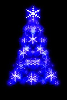 Symmetrical Christmas tree shape made up from glowing snowflake shapes