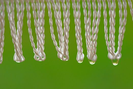 Drops of water on a fringe of a umbrella