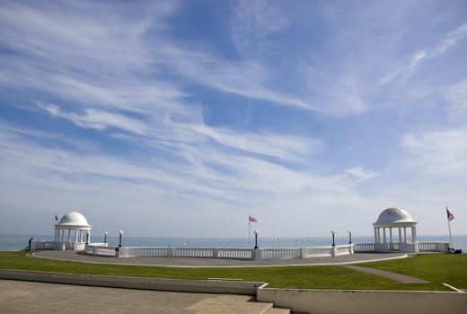 A promenade with two domed buildings
