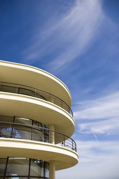 An Art-deco balcony against a blue sky