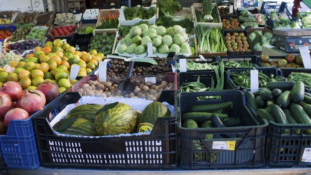 Fruit and vegetables on display on a stand in a Spanish open-air market.