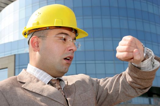 confused a businessman looking at his watch
