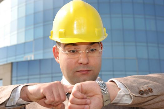 confused a businessman looking at his watch
