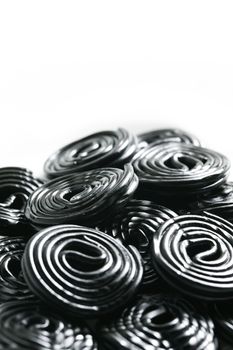 Rolls of tasty liquorice candy rolls isolated on white