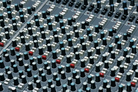 Detail of a mixing board in a recording studio - This is shot in a real studio  - some dust visible
