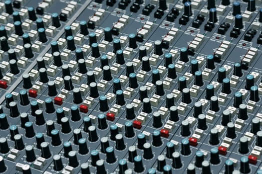 Detail of a mixing board in a recording studio - This is shot in a real studio  - some dust visible