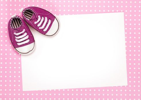 Blank card with pink baby shoes and space for copy