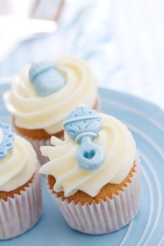 Cupcakes decorated with a baby shower theme