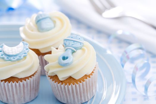 Cupcakes decorated with a baby shower theme