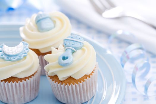 Cupcakes decorated with a baby shower theme