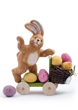 Cute Easter bunny delivering chocolate mini eggs
