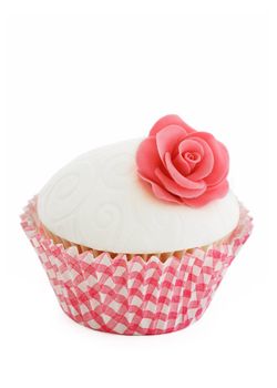 Pink rose cupcake isolated on a white background