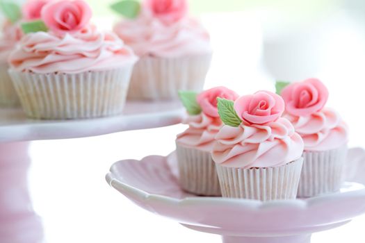 Cupcakes decorated with pink sugar roses