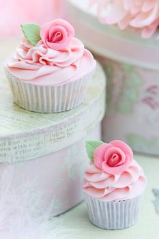 Cupcakes decorated with pink sugar roses