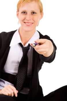 Business woman with a blue pen. Focus is on the hand with the pen.