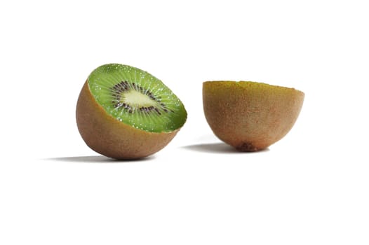 Kiwi sliced in half against a white background.