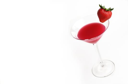 Red drink in martini glass with strawberry against white background.