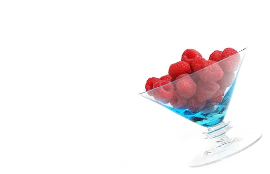 Raspberries in dessert bowl against white background.