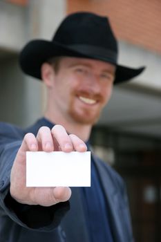 Businessman holding calling card