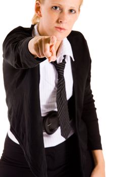 Business woman is poiting at you. Focus is on the hand which is poiting.