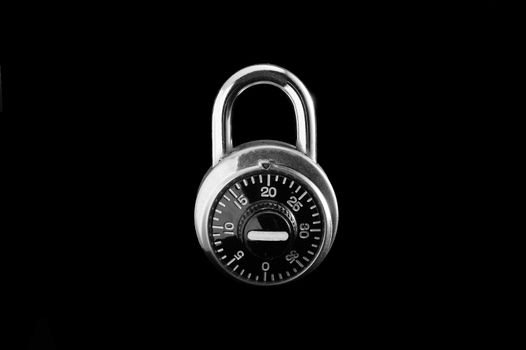 Combination lock on black background.