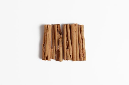 Cinnamon sticks dispaly isolated on white background.