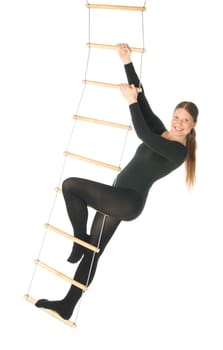 Isolated photo of a woman on a rope ladder
