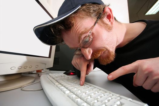 mad programmer sitting at a computer desk