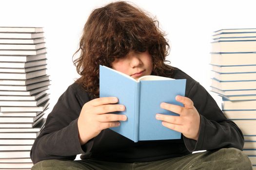 boy reading a book and many books on white background