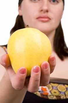 Apple close up. The girl gives fruit.