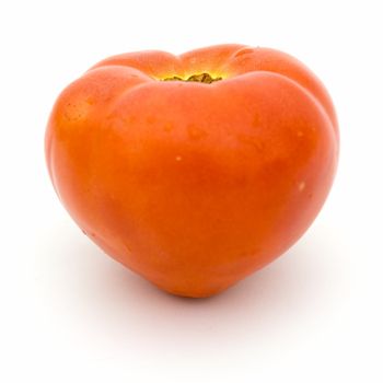 Tomato similar to heart on a white background.