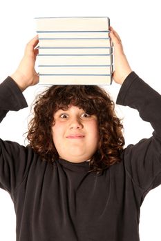 boy with books on head on white background
