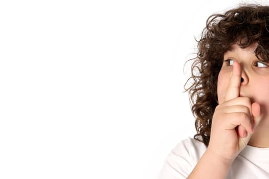 boy gestures for silence on white background