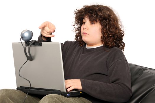 boy using laptop and webcam on white background