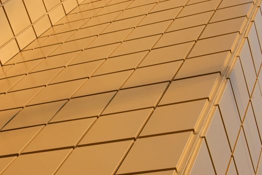 wall of modern office building, gold color