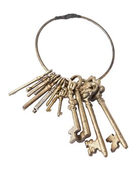 Antique golden keychain with several keys isolated on white background with clipping path