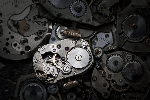 Close-up of antique clockwork. This is an extreme close-up of old clockwork so there is some dust visible.