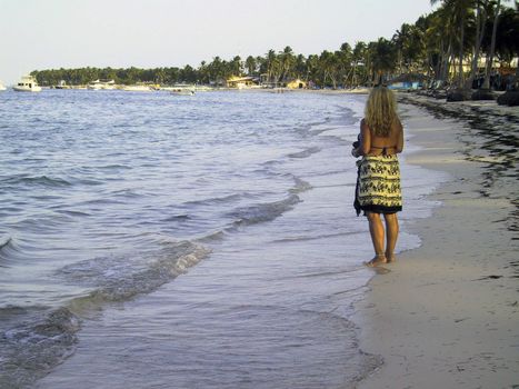Women alone on a beach in the Caribbean