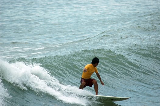 Sports surfing on a beach in Bali