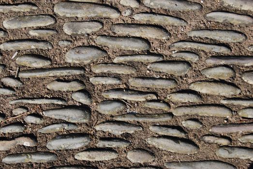 abstract of a pavement made out of concrete and stones