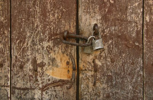 Gates old house with a padlock