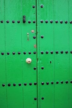 Details of green with a door lock