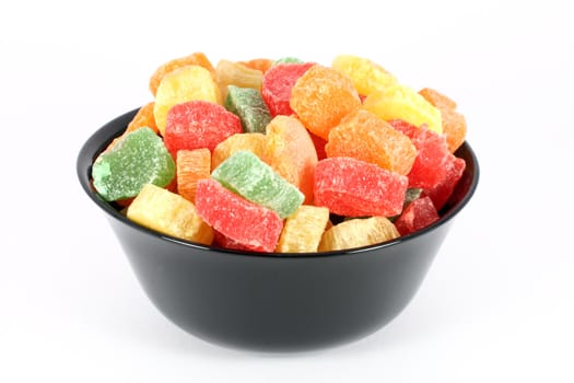 Colorful jelly candies in black bowl,  isolated on white